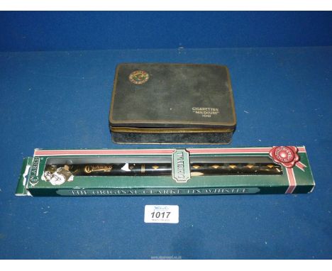 An original Clarke tin whistle in an unopened box and a vintage Players Cigarettes tin, black, medium 100 - empty.