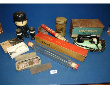 A quantity of miscellanea including Pyrex rolling pin, three Homepride men, flit sprayer, hair clippers, old iron etc.