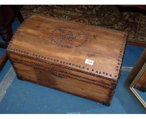 A Pine domed top Trunk of small dimensions, studded and with the initial W to the top, one brass drop handle incomplete, 23''