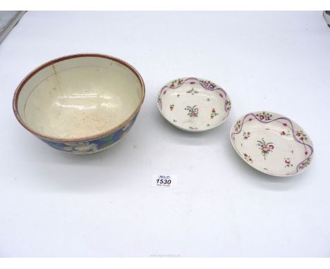 A pair of early 19th century pearlware saucers painted with flowers within ribbon borders, 5" diameter and a Staffordshire lu