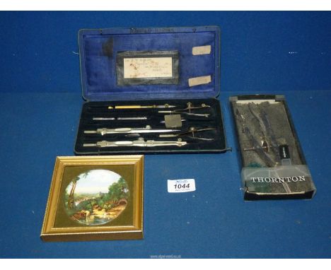 A Thornton Precision Compass plus another similar, and a miniature Staffordshire ceramic plaque.