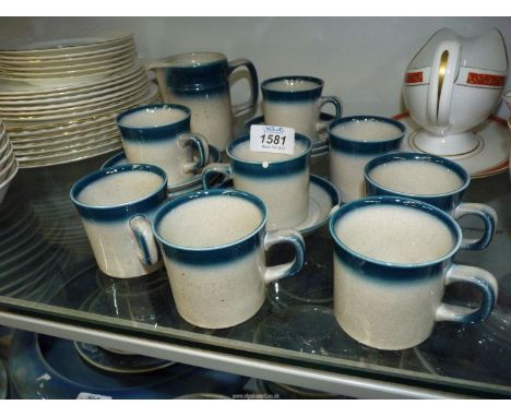 A Wedgwood 'Blue Pacific' part Coffee set to include eight cups &amp; seven saucers and a milk jug, one cup &amp; saucer chip