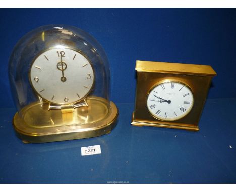 A Kundo electronic clock in working order, with the clock repairers bill enclosed along with a Pleasance &amp; Harper Herefor