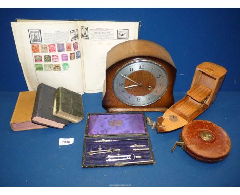 A mantle clock (with key), a boat cigarette box, part old compass set, leather bound tape measure, two silver thimbles, Commo