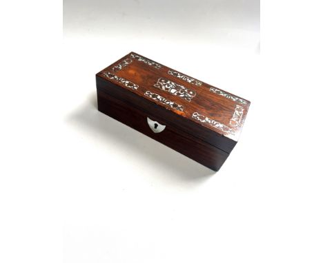 Rosewood box. Circa 1860. Of rectangular for. With mother of pearl inlay.