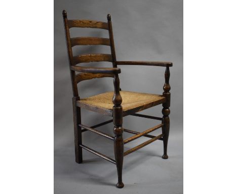 A Rush Seated Oak Framed Ladder Back Armchair with Brass Commemorative Plaque, "In Remembrance of May 28th 1913" 