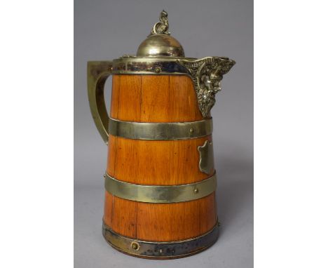 A Silver Plate Banded Oak Mask Head Lidded Jug with Ceramic Inner, 25cm High