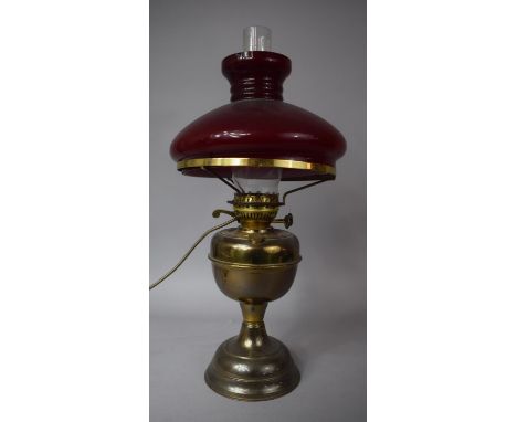 An Early 20th Century Oil Lamp Converted to Electric Table Lamp with Red Opaque Glass Shade, 49cm high 