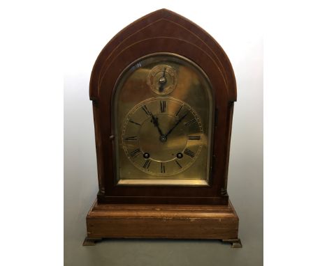A Winterhalder &amp; Hofmeier mahogany cased ting tang movement mantel clock with brass faced dial and four brass bracket fee