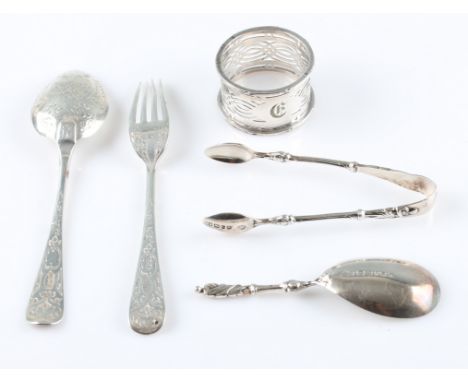 A Victorian boxed pair of sugar tongs and spoon, hallmarked Sheffield 1878/1877, together with an engraved spoon, hallmarked 