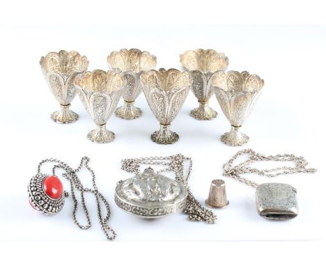 A collection to include, a Victorian silver vesta case hallmarked Birmingham 1894, six white metal egg cups, two white metal 