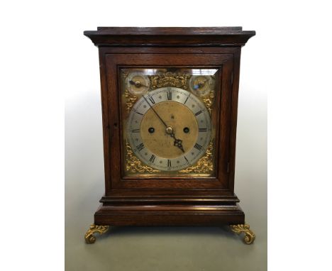 A German oak cased four glass panelled bracket clock, with a double fusee chain driven movement and single striking bell, bra