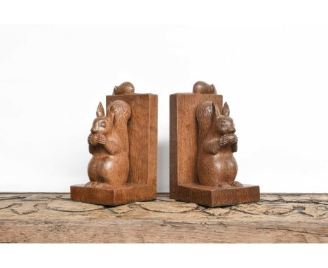 Workshop of Robert Mouseman Thompson (Kilburn): A Pair of Carved English Oak Red Squirrel Bookends, both sitting up on their 