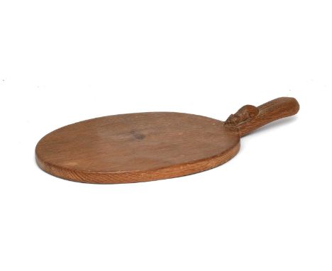 Workshop of Robert Mouseman Thompson (Kilburn): An English Oak Cheese Board, post 1960, of standard form, with carved mouse t