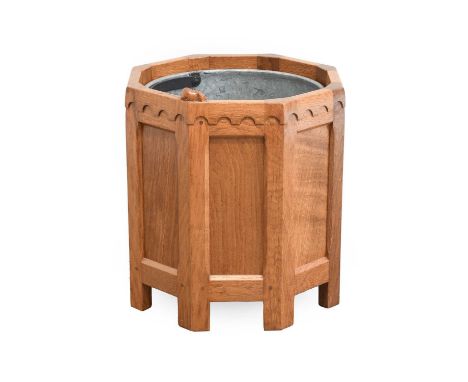 Workshop of Robert Mouseman Thompson (Kilburn): An English Oak Octagonal Planter, contrasting fumed oak panels, penny moulded