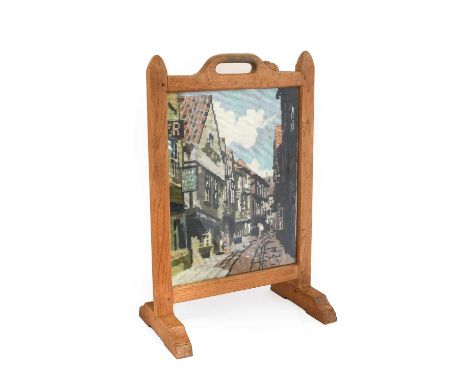 Workshop of Robert Mouseman Thompson (Kilburn): An English Oak Fire Screen, 1974, the frame inset with a woolwork picture of 