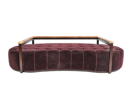 George Smith Ltd: A Two-Seater Sofa, modern, covered in buttoned burgundy velvet, with stained beech frame and brown leather 