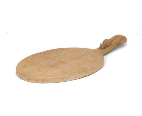 Workshop of Robert Mouseman Thompson (Kilburn): An English Oak Cheese Board, post 1960, of standard form, with carved mouse t