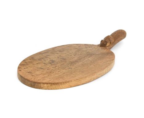 Workshop of Robert Mouseman Thompson (Kilburn): An English Oak Cheese Board, post 1960, of standard form, with carved mouse t