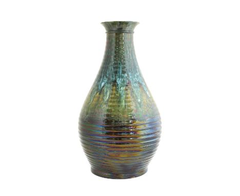 Christopher Dresser (Scottish, 1834-1904) for Linthorpe Pottery: A Vase, ribbed body, green, blue and brown glaze, impressed 