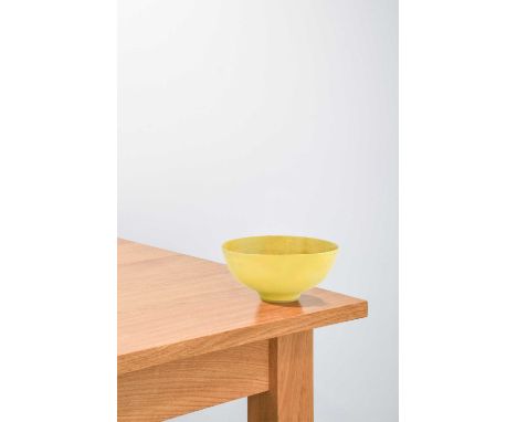 Lucie Rie (1902-1995): A Stoneware Footed Bowl, covered in a yellow glaze, impressed LR mark,17cm diameter (restored)Extensiv