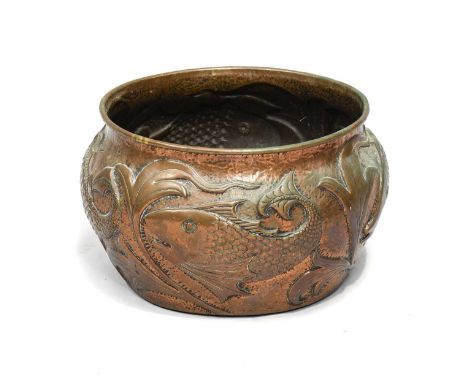 An Arts & Crafts Copper Planter, by John Pearson, repoussé decorated with fish, stamped J.P 1905 6020,45cm diameter, 26cm hig