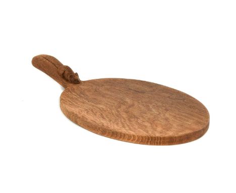 Workshop of Robert Mouseman Thompson (Kilburn): An English Oak Cheese Board, post 1960, of standard form, with carved mouse t