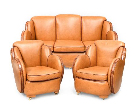 An Art Deco Cloud Three Piece Suite, re-upholstered in tan leather, trimmed in walnut, with cognac piping, comprising three-s