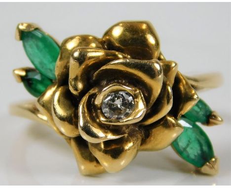 A 14ct gold ring with rose design set with diamond &amp; emerald 6.7g size N