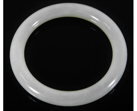 A vintage Oriental pale green jade bangle