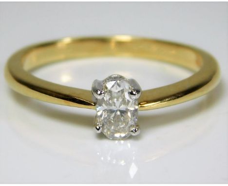 An 18ct gold solitaire ring set with approx. 0.5ct oval diamond 3.8g size R