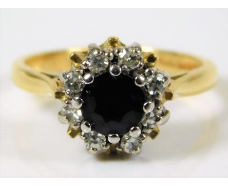 An 18ct gold ring set with sapphire &amp; approx. 0.25ct diamond 4.5g size L