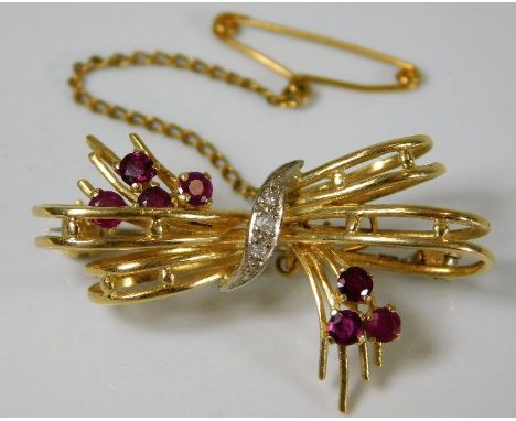 An 18ct gold brooch set with diamonds &amp; ruby 7g
