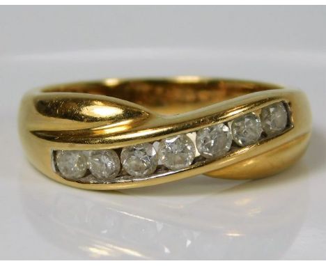 An 18ct gold ring set with seven diamonds of approx. 0.5ct 5g size O/P 