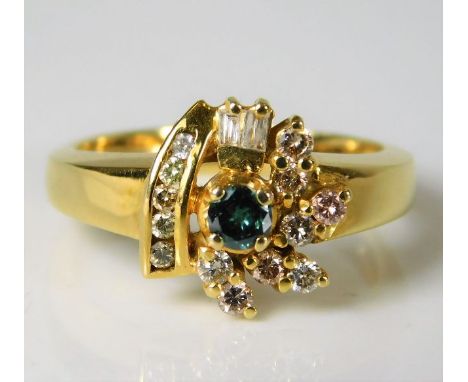 A yellow metal ring, tests as 15ct, set with green &amp; white diamonds 4.2g size M