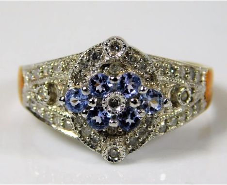 A 9ct gold ring set with approx. 0.28ct diamonds &amp; topaz size R 