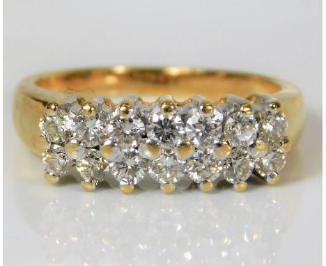 An 18ct gold diamond ring set with fourteen diamonds of approx. 0.7ct 6.1g size O/P 