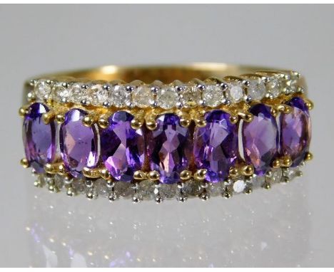 A 9ct gold ring set with approx. 0.39ct diamond &amp; amethyst 3.4g size P