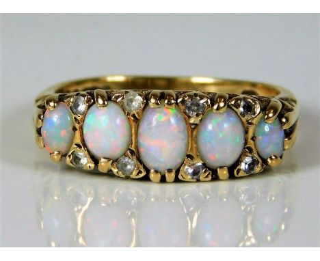 A 9ct gold ring set with opal &amp; paste stones 4.8g size P