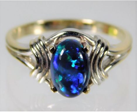 An 18ct white gold ring set with Australian black opal 4.2g size P 