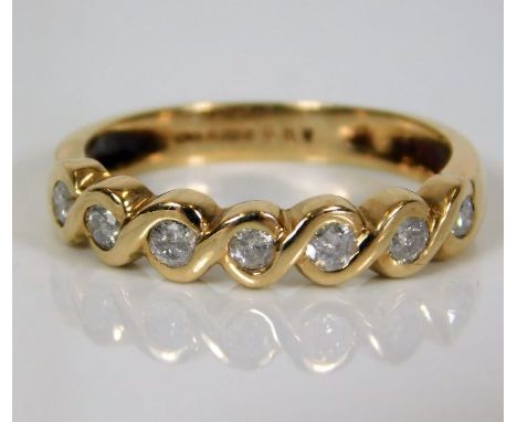 A 9ct gold half eternity ring set with approx. 0.35ct of diamonds 2.4g size N/O