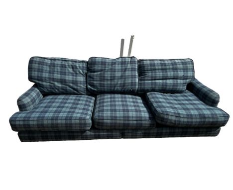 A three seater blue tartan upholstered sofa, and a blue upholstered foot stool (115cm x 77cm).  250 cm 