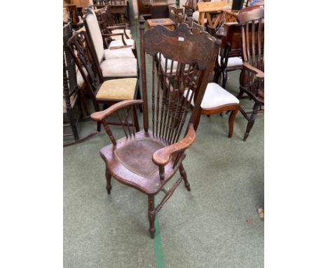 A bobbin turned rocking chair with reeded seat (some losses); and an oak Windsor style high backed arm chair, with spindle ba