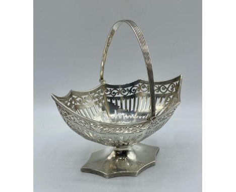 A sterling silver octagonal pierced Bonbon dish with swing handle, by Haseler and Bill, London 1901 183 g 