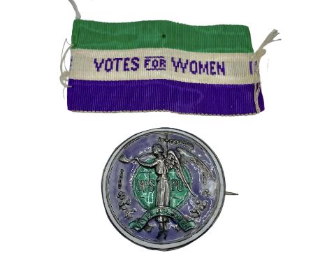 A rare suffragette 'Angel of Freedom' brooch. Circular sterling silver, green and purple enamel brooch designed by Sylvia Pan