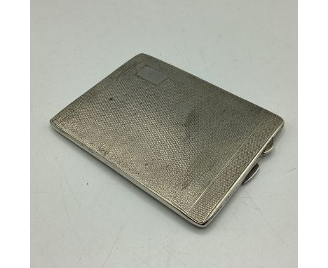 A sterling silver cigarette case with engine turned decoration and gilt interior by Joseph Gloster, Birmingham. 1943. 134g 
