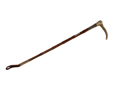 A hunting whip with silver collar (with wear), Swane Adeny, London 