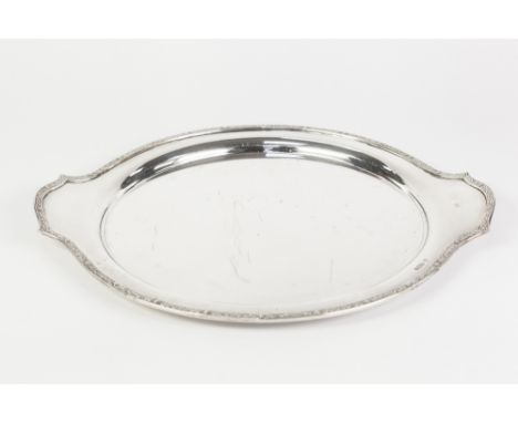 A POST WAR SILVER CIRCULAR TWO HANDLED TRAY, cast with a narrow Celtic  style border, Sheffield 1959, 40oz 