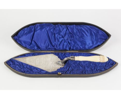 EDWARDIAN SILVER PRESENTATION TROWEL, with foliate scroll engraved blade, carved and turned ivory handle, 13" long, Birmingha