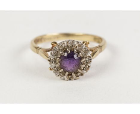 18ct GOLD, AMETHYST AND DIAMOND CLUSTER RING, set with a centre circular amethyst and surround of tiny diamonds, 4.5gms 